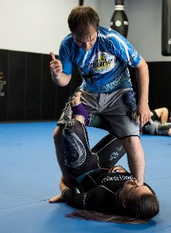 Two students practicing no-gi Brazilian Jiu-Jitsu at 10th Planet Beaumont