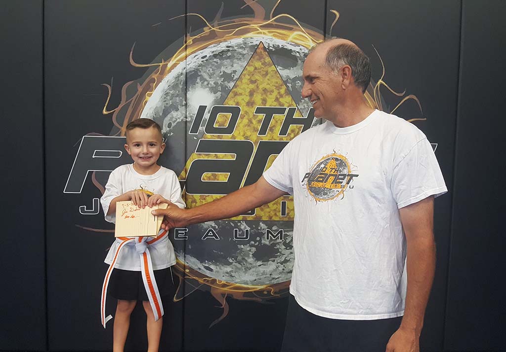 Kids building confidence through board breaking at 10th Planet Beaumont