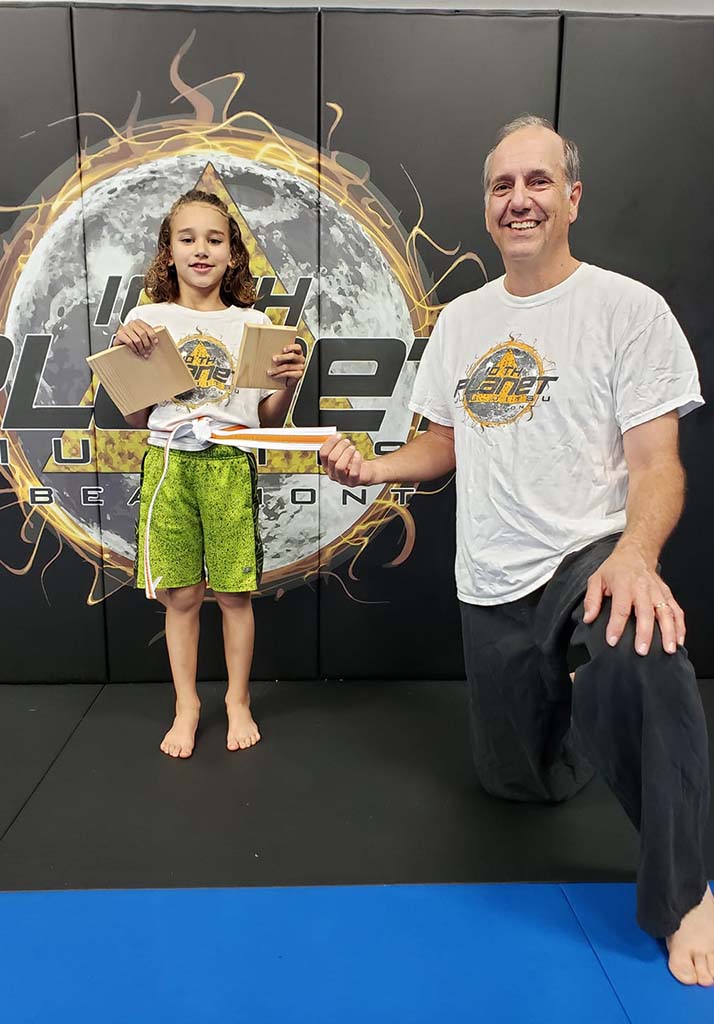 Building individual achievement through martial arts — board breaking at 10th Planet Beaumont