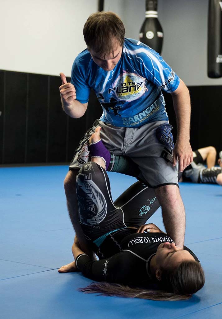 Men and women training self-defense together at 10th Planet Beaumont
