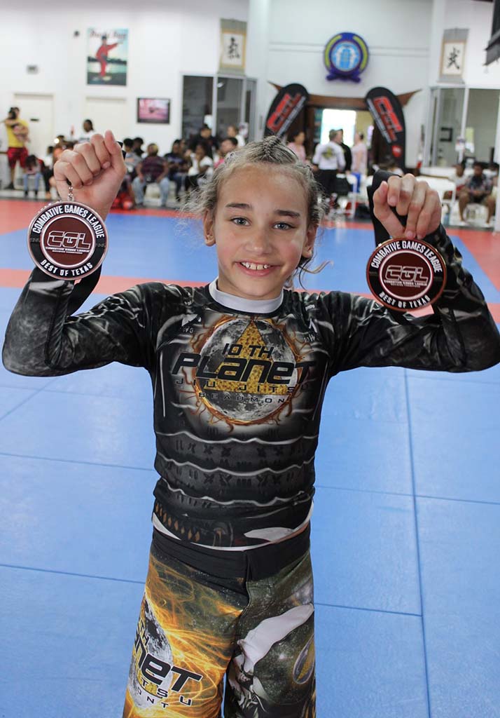 Youth competitors earning medals — martial arts builds discipline sports can't