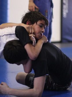 Children learning Brazilian Jiu-Jitsu techniques at 10th Planet Beaumont