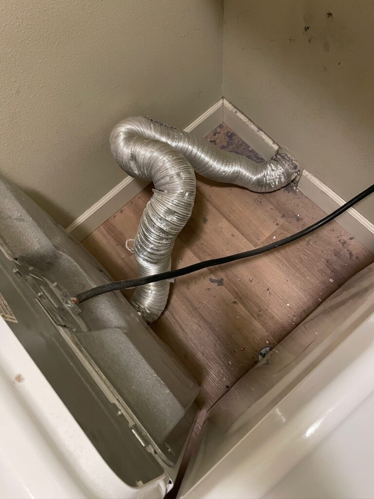 Long dryer vent routing through a wall
