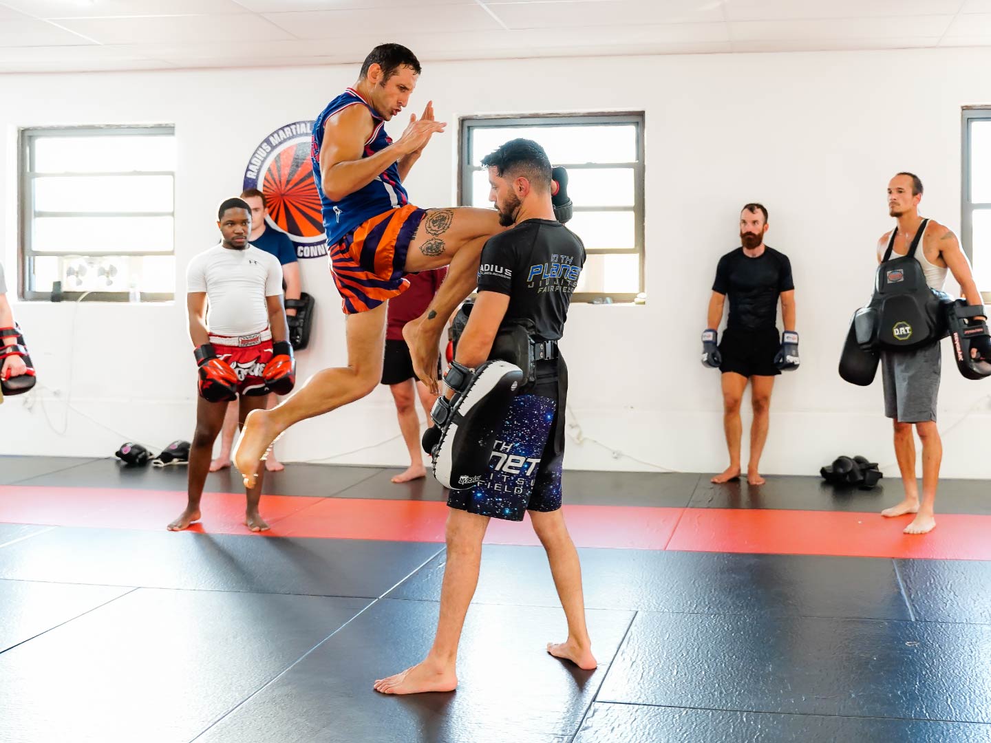 Kru Tom Billinge leading a Muay Thai striking class at Radius Martial Arts Academy in Fairfield, CT